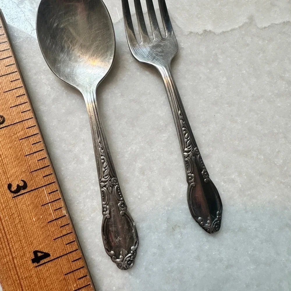 Small silverplate utensils.